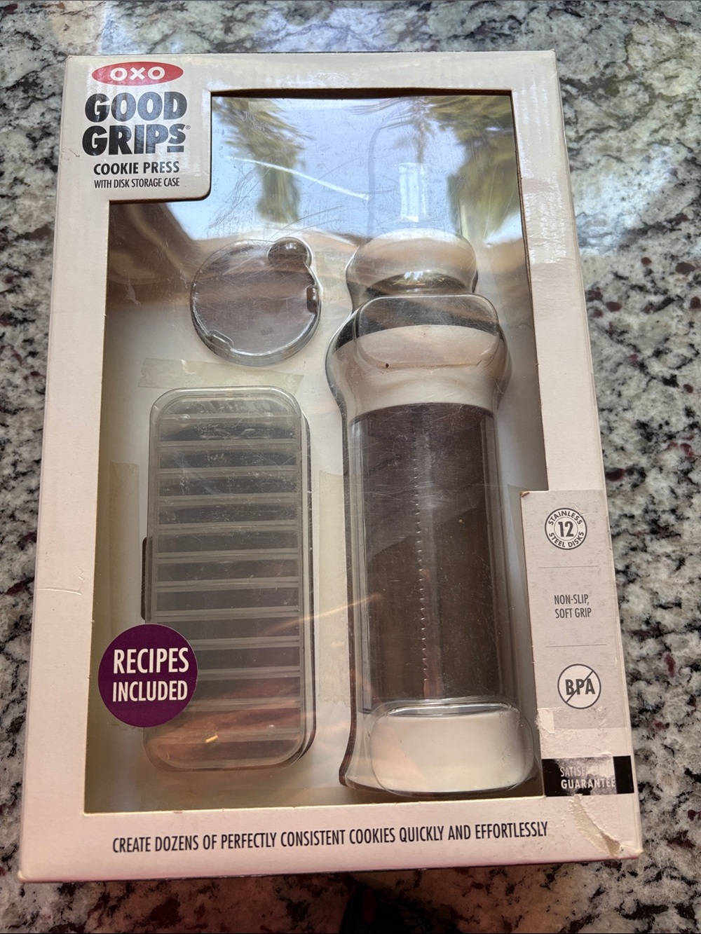 Oxo Good Grips Cookie Press with recipes and 12 discs. Used one time.